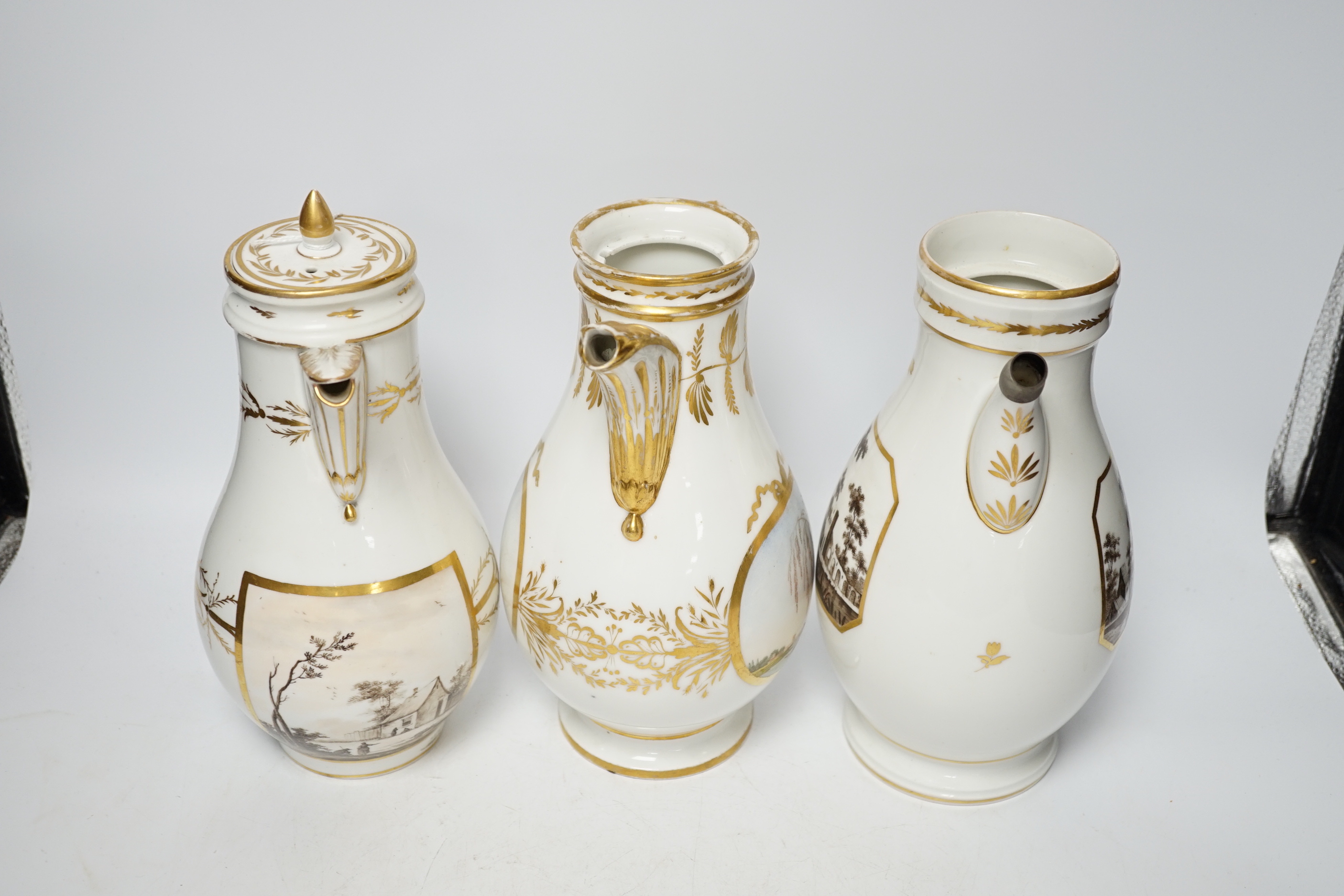 A pair and another 19th century French porcelain coffee pots, one with cover, 27cm